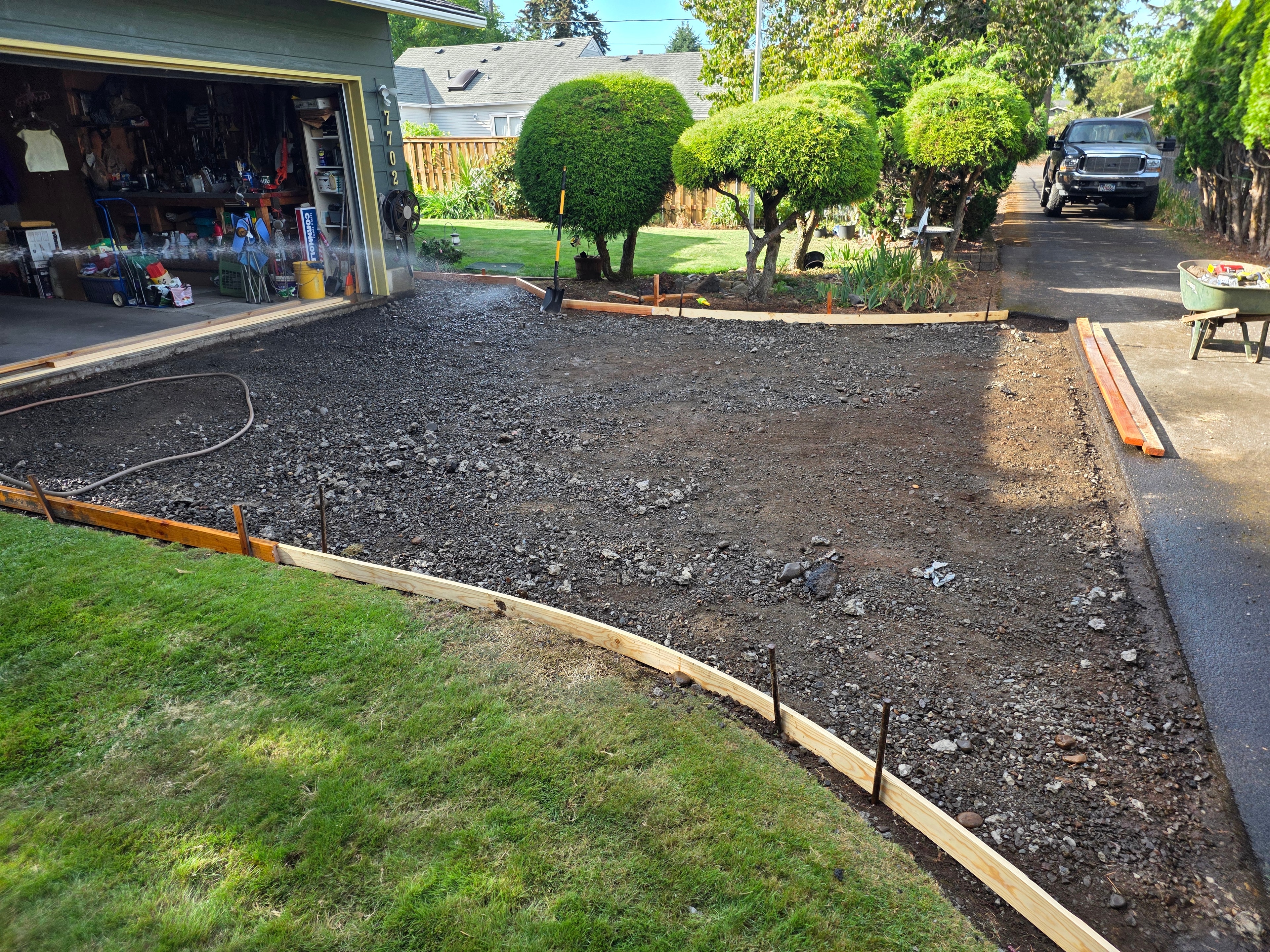 Concrete demolition in progress breaking out old driveway slab