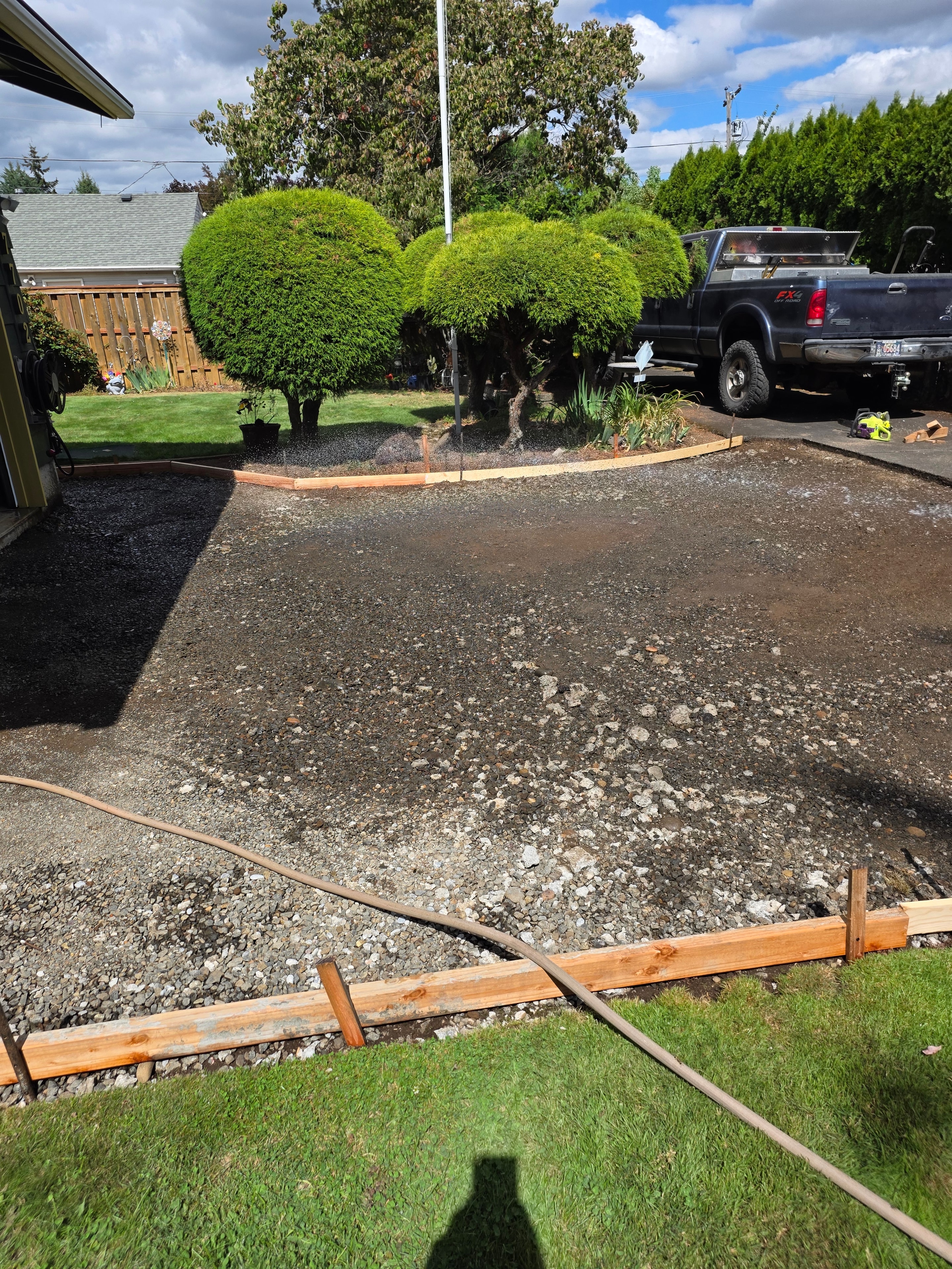 Driveway forms set and base compacted, ready for pour