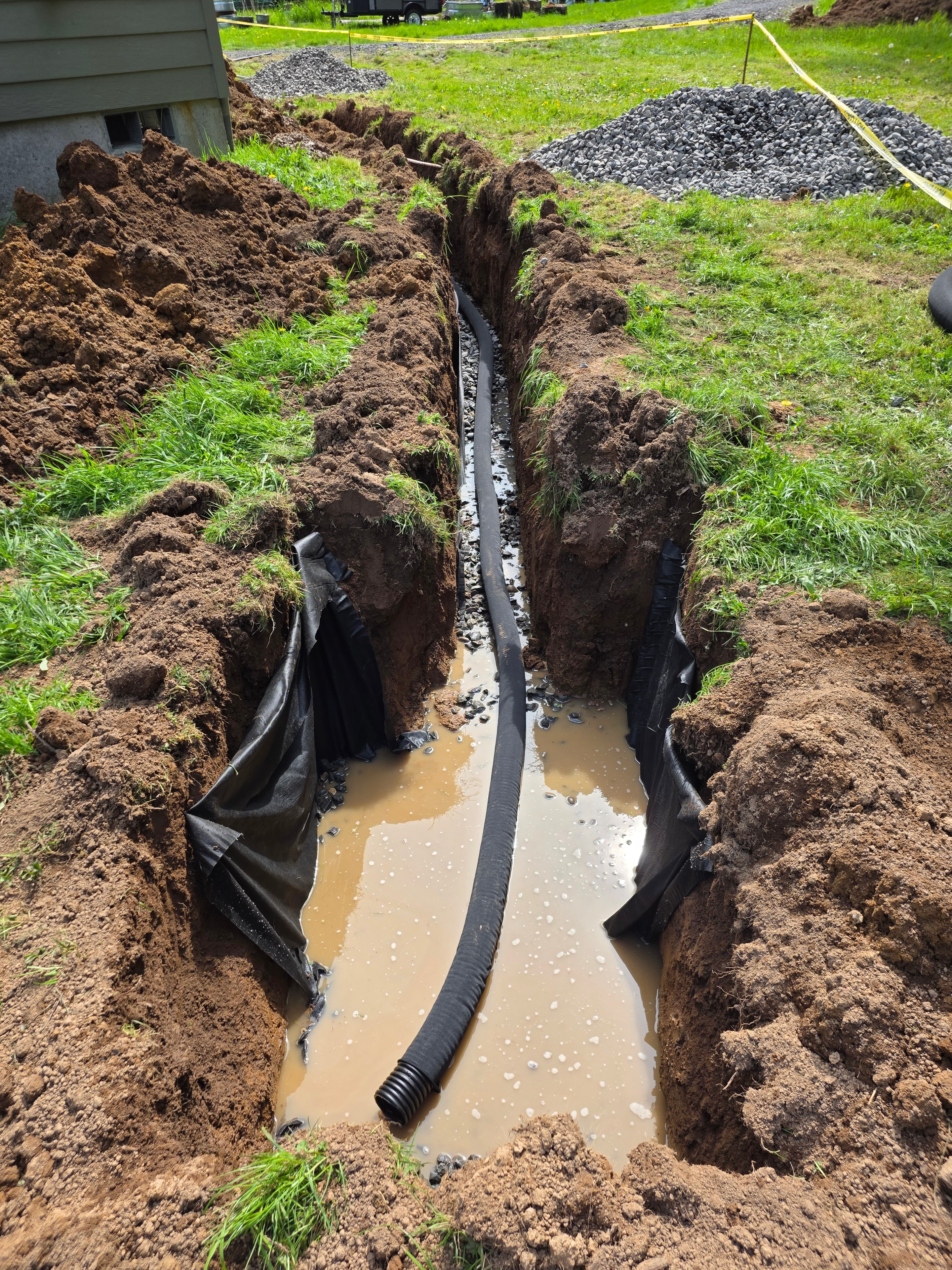 French drain work nearing completion Portland front yard
