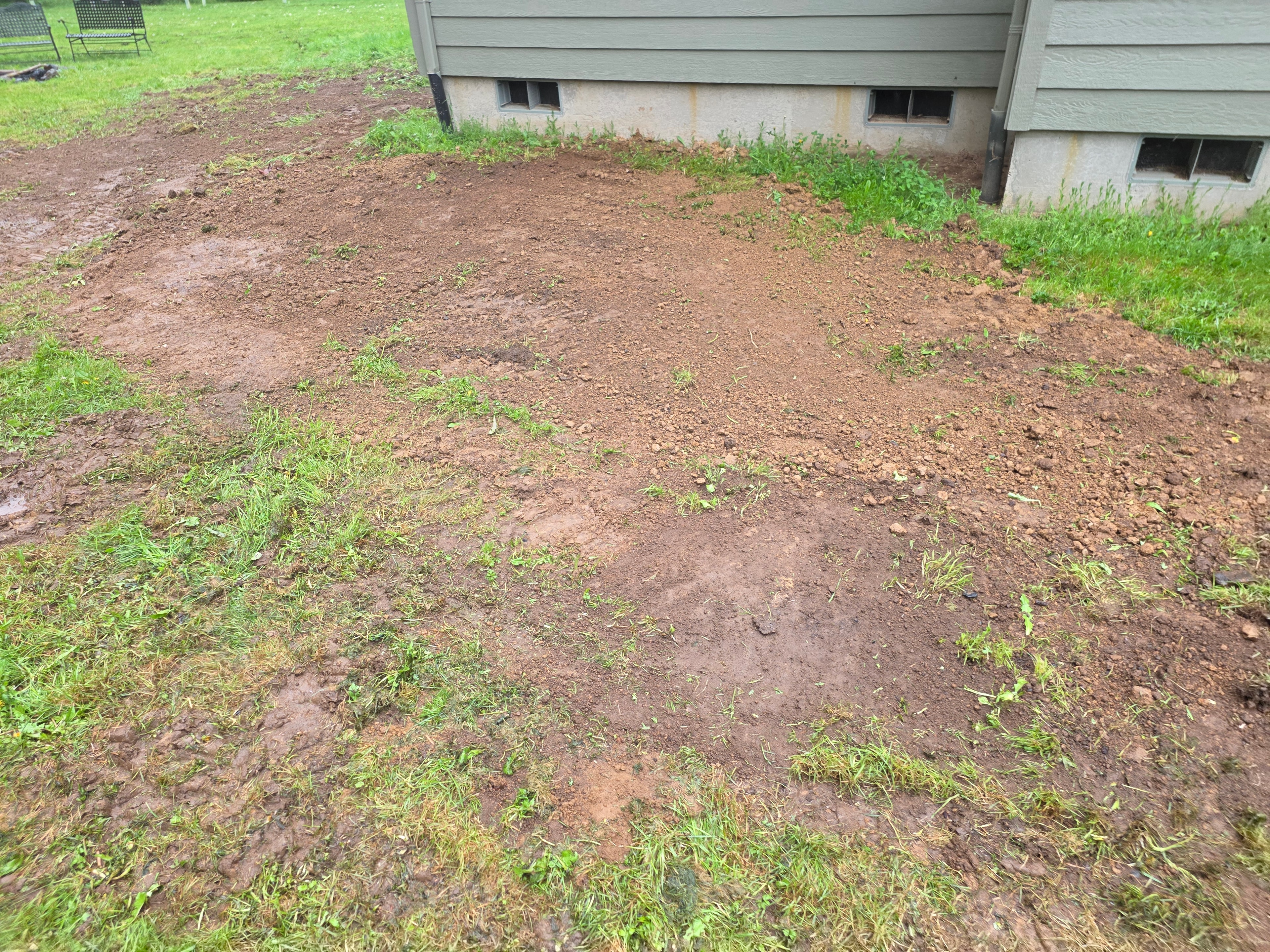 Backyard slope outlet where drain routes water for runoff