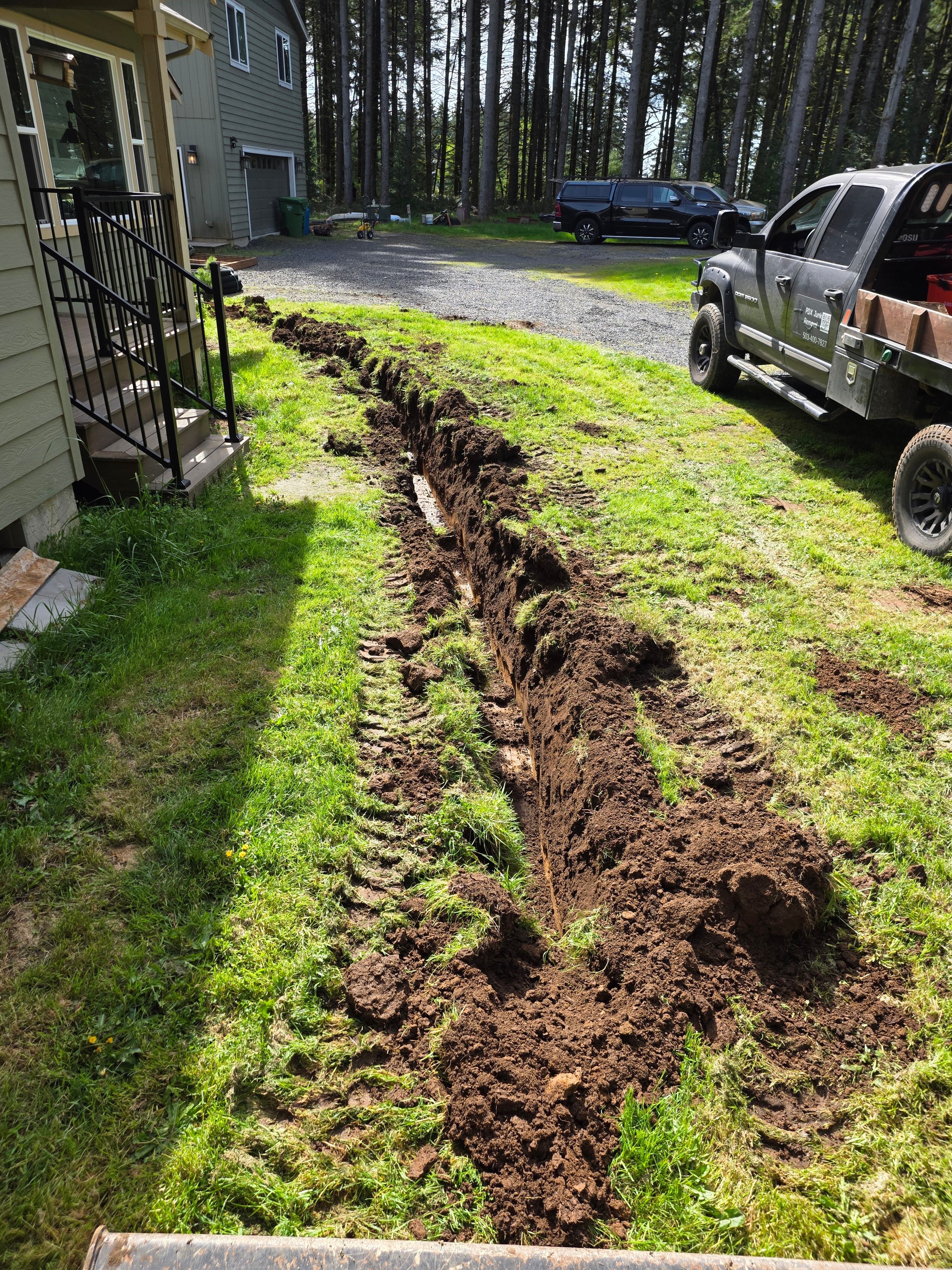 French drain trench open in Portland front yard