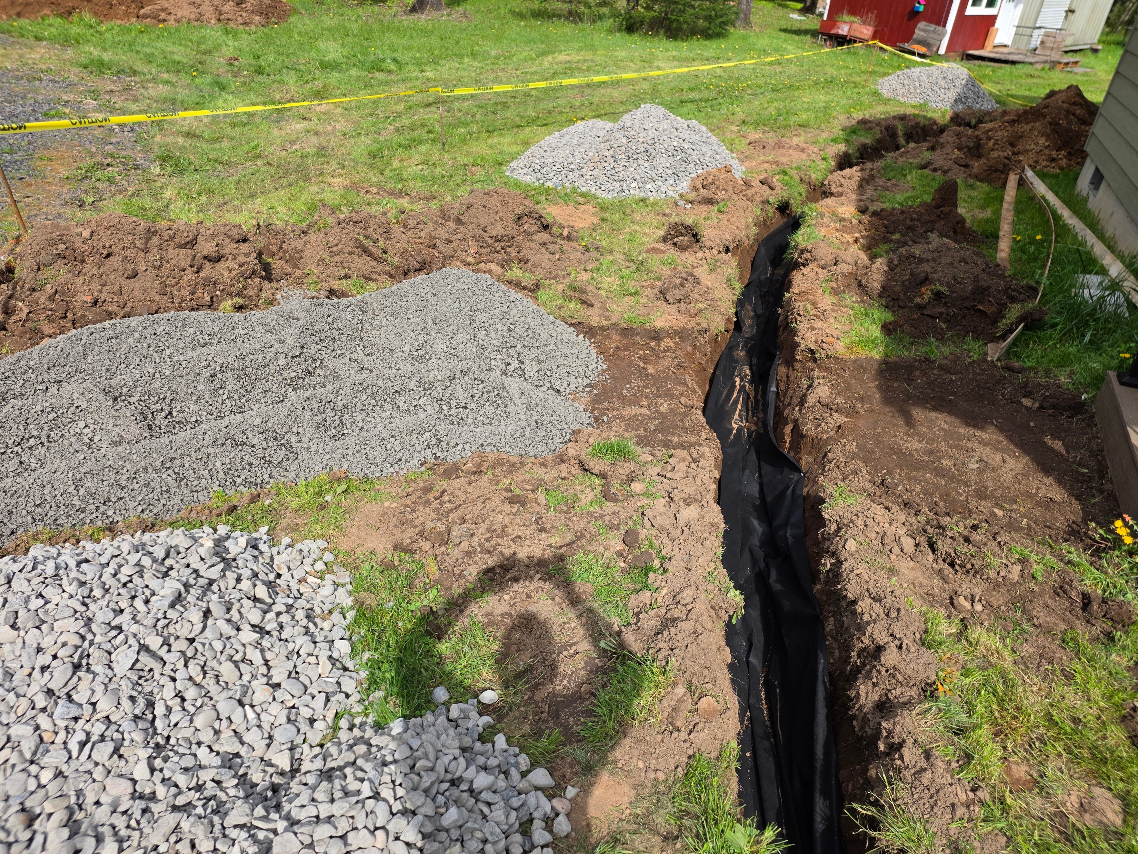 Drain rock and pipe installation in progress